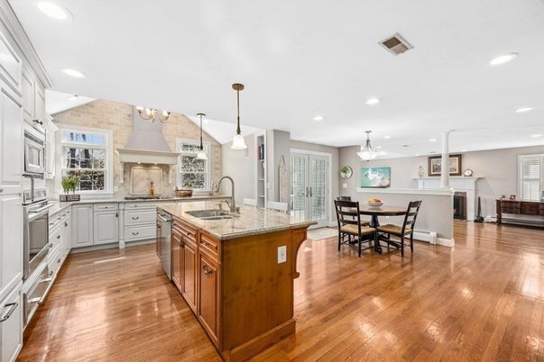 Chandelier, Dining room, Interior, Kitchen, Pendant Lights, Recessed Lighting, Stainless Steel Appliances, Wood Texture Flooring