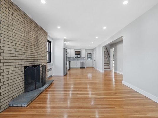 Empty room, Fireplace, Interior, Kitchen, Recessed Lighting, Stone Walls, Wood Texture Flooring