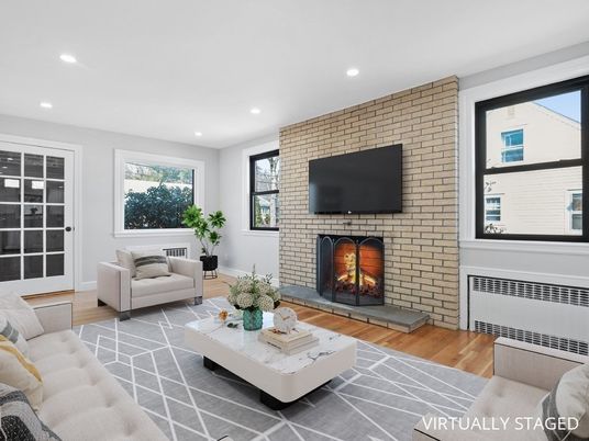 Fireplace, Interior, Living room, Recessed Lighting, Stone Walls, Wood Texture Flooring
