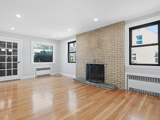 Empty room, Fireplace, Interior, Recessed Lighting, Stone Walls, Wood Texture Flooring
