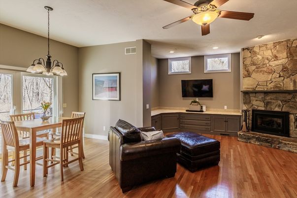 Chandelier, Dining room, Fireplace, Interior, Recessed Lighting, Stone Walls, Wood Texture Flooring