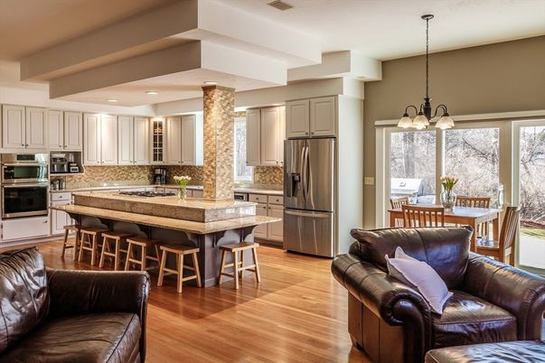 Chandelier, Dining room, Interior, Kitchen, Living room, Pendant Lights, Recessed Lighting, Stainless Steel Appliances, Wood Texture Flooring