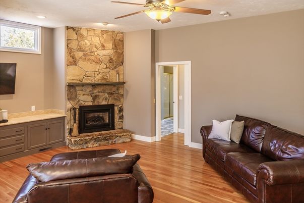 Fireplace, Interior, Recessed Lighting, Stone Walls, Wood Texture Flooring