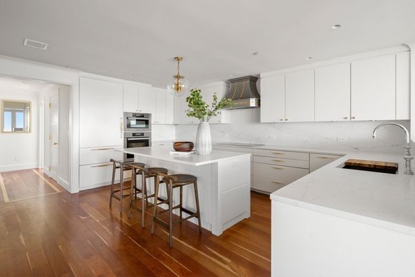 Interior, Kitchen, Marble Walls, Pendant Lights, Recessed Lighting, Stainless Steel Appliances, Wood Texture Flooring
