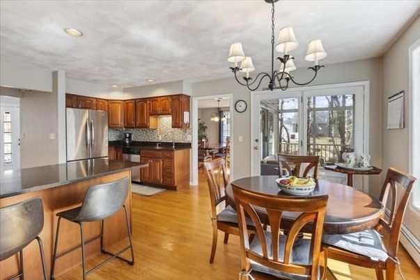 Chandelier, Dining room, Interior, Kitchen, Pendant Lights, Recessed Lighting, Stainless Steel Appliances, Wood Texture Flooring