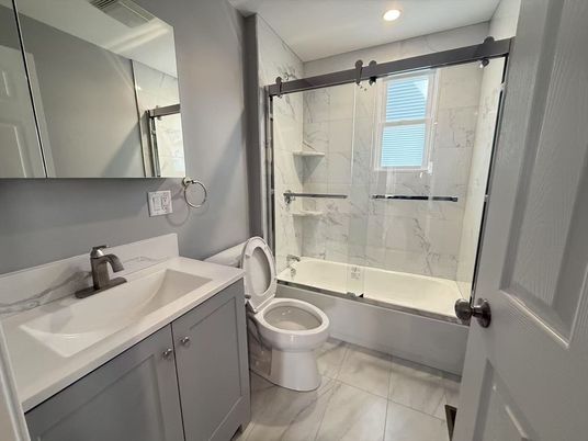 Bathroom, Dual Sink Vanities, Glass Shower, Interior, Marble, Marble Walls, Recessed Lighting