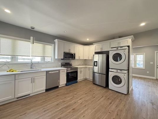Interior, Kitchen, Recessed Lighting, Stainless Steel Appliances, Washer, Wood Texture Flooring