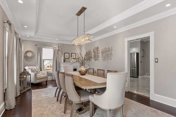 Chandelier, Dining room, Interior, Kitchen, Living room, Pendant Lights, Recessed Lighting, Stainless Steel Appliances, Wood Texture Flooring
