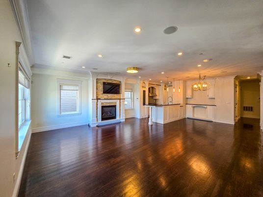 Chandelier, Empty room, Fireplace, Interior, Kitchen, Recessed Lighting, Wood Texture Flooring