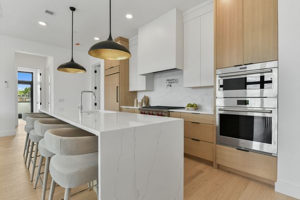 Interior, Kitchen, Marble Walls, Pendant Lights, Recessed Lighting, Stainless Steel Appliances, Wood Texture Flooring