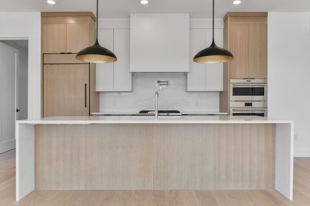 Interior, Kitchen, Marble Walls, Pendant Lights, Recessed Lighting, Stainless Steel Appliances, Wood Texture Flooring