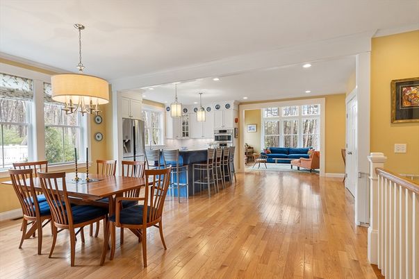 Chandelier, Dining room, Interior, Kitchen, Living room, Pendant Lights, Recessed Lighting, Stainless Steel Appliances, Wood Texture Flooring