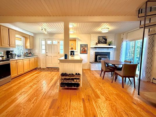 Dining room, Fireplace, Interior, Kitchen, Stainless Steel Appliances, Stone Walls, Wood Texture Flooring