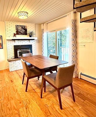 Dining room, Fireplace, Interior, Stone Walls, Wood Texture Flooring