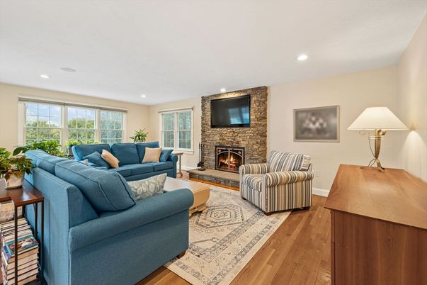 Fireplace, Interior, Living room, Recessed Lighting, Stone Walls, Wood Texture Flooring