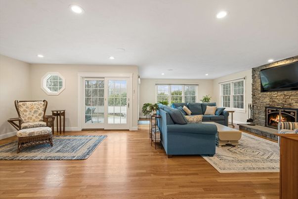 Fireplace, Interior, Living room, Recessed Lighting, Stone Walls, Wood Texture Flooring