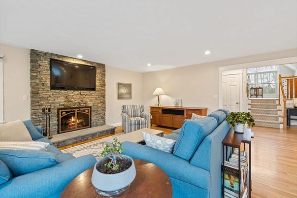Fireplace, Interior, Living room, Recessed Lighting, Stone Walls, Wood Texture Flooring