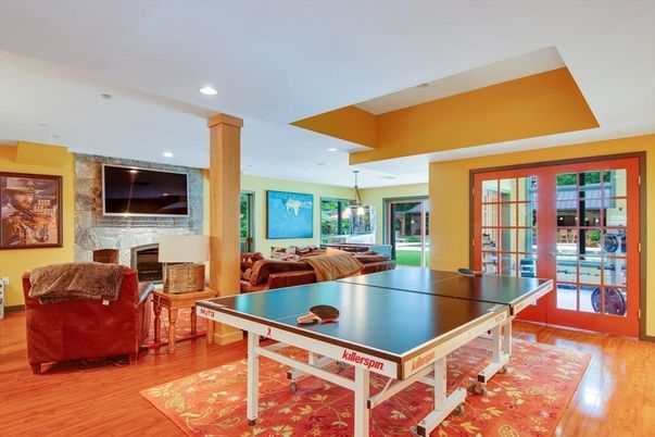 Fireplace, Game Room, Interior, Pendant Lights, Recessed Lighting, Wood Texture Flooring