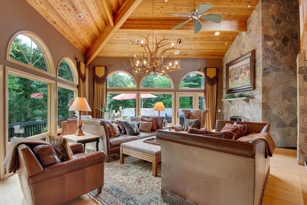 Chandelier, Fireplace, Interior, Living room, Recessed Lighting, Stone Walls, Wooden Beams, Wooden Ceilings, Wood Texture Flooring