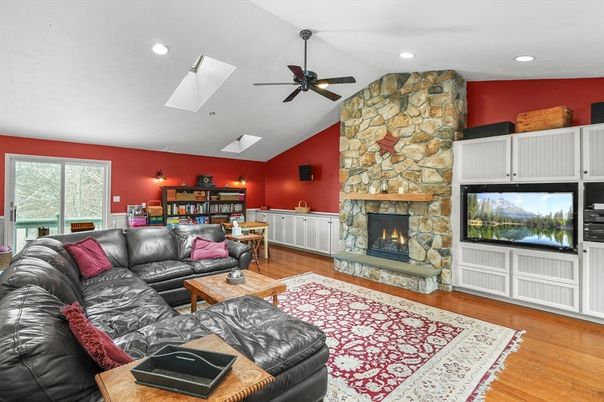 Fireplace, Interior, Living room, Recessed Lighting, Stone Walls, Wood Texture Flooring