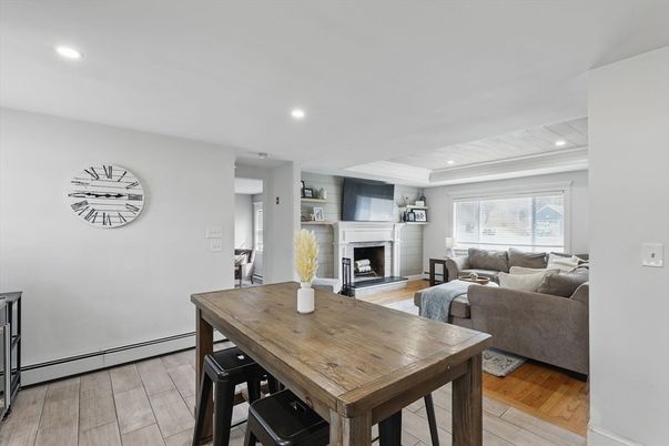 Dining room, Fireplace, Interior, Living room, Recessed Lighting, Wood Texture Flooring