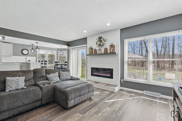 Dining room, Fireplace, Interior, Living room, Pendant Lights, Recessed Lighting, Wood Texture Flooring