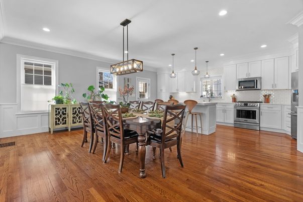 Dining room, Interior, Kitchen, Pendant Lights, Recessed Lighting, Stainless Steel Appliances, Wood Texture Flooring