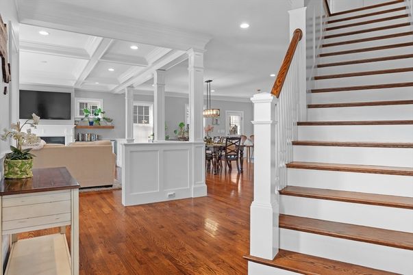 Chandelier, Dining room, Fireplace, Interior, Living room, Pendant Lights, Recessed Lighting, Wood Texture Flooring