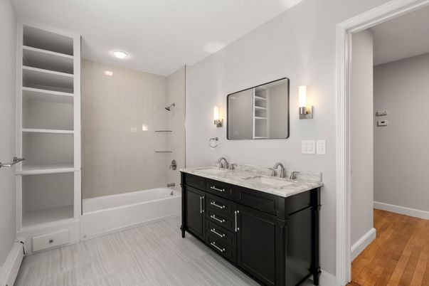 Bathroom, Dual Sink Vanities, Glass Shower, Interior, Recessed Lighting, Wood Texture Flooring