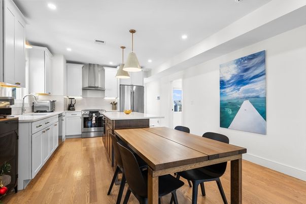 Dining room, Interior, Kitchen, Pendant Lights, Recessed Lighting, Stainless Steel Appliances, Wood Texture Flooring