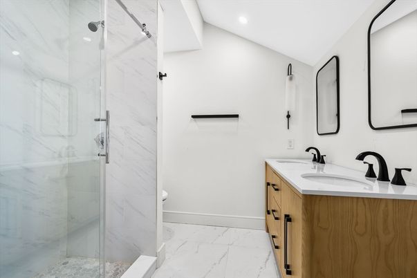 Bathroom, Dual Sink Vanities, Glass Shower, Interior, Marble, Marble Walls, Recessed Lighting