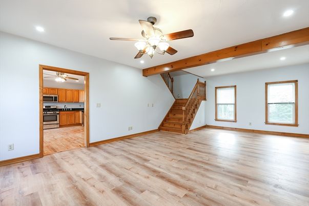 Empty room, Interior, Kitchen, Recessed Lighting, Stainless Steel Appliances, Wooden Beams, Wood Texture Flooring
