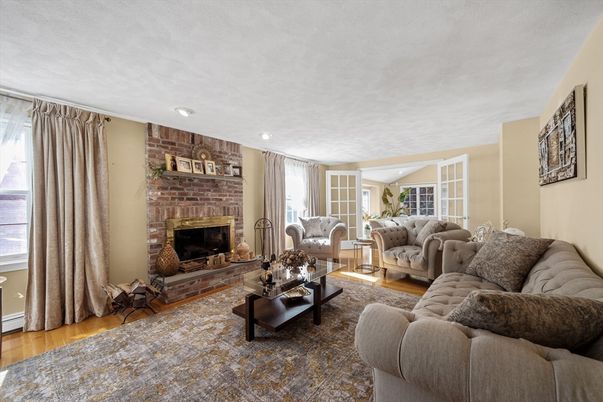 Fireplace, Interior, Living room, Recessed Lighting, Stone Walls, Wood Texture Flooring