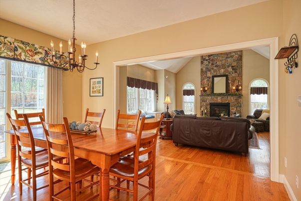 Chandelier, Dining room, Fireplace, Interior, Living room, Stone Walls, Wood Texture Flooring