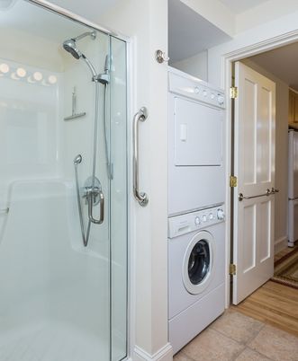 Bathroom, Glass Shower, Interior, Utility Closets, Washer, Wood Texture Flooring