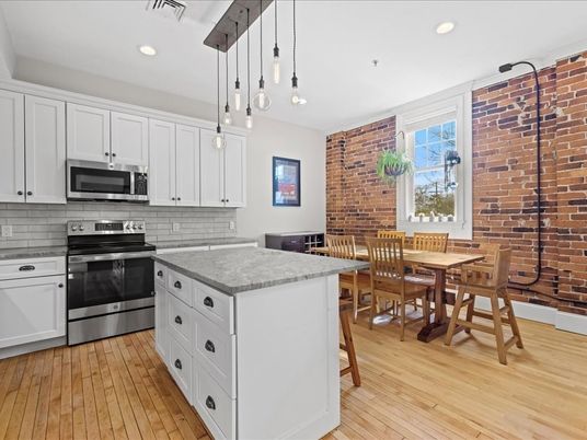 Dining room, Interior, Kitchen, Pendant Lights, Recessed Lighting, Stainless Steel Appliances, Stone Walls, Wood Texture Flooring