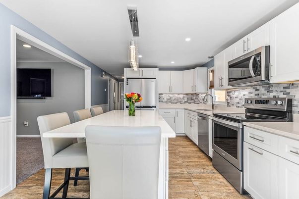 Dining room, Interior, Kitchen, Pendant Lights, Recessed Lighting, Stainless Steel Appliances, Wood Texture Flooring