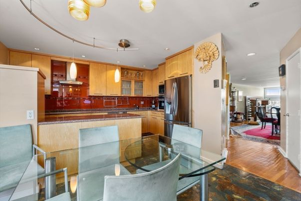 Dining room, Interior, Kitchen, Pendant Lights, Recessed Lighting, Stainless Steel Appliances, Wood Texture Flooring