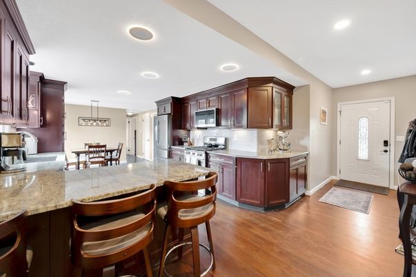 Dining room, Interior, Kitchen, Pendant Lights, Recessed Lighting, Stainless Steel Appliances, Wood Texture Flooring