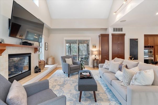 Fireplace, Interior, Kitchen, Living room, Recessed Lighting, Stainless Steel Appliances, Wood Texture Flooring