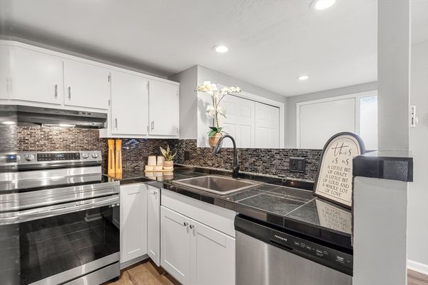 Interior, Kitchen, Recessed Lighting, Stainless Steel Appliances, Tile Countertops, Wood Texture Flooring