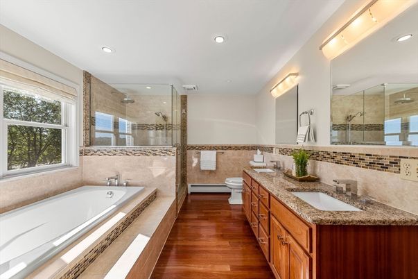 Bathroom, Dual Sink Vanities, Glass Shower, Interior, Recessed Lighting, Wood Texture Flooring