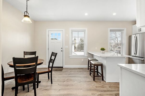 Dining room, Interior, Kitchen, Pendant Lights, Recessed Lighting, Stainless Steel Appliances, Wood Texture Flooring