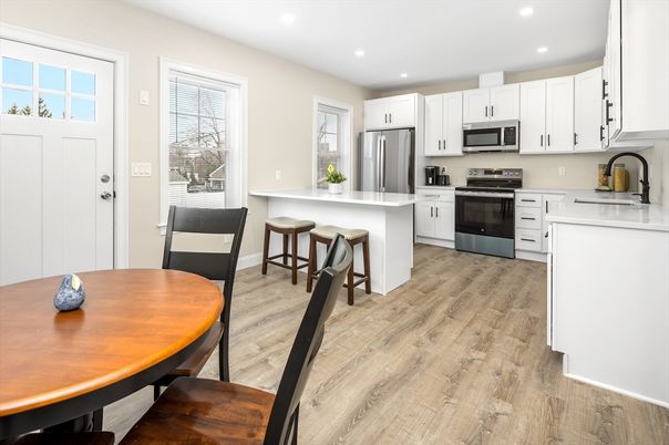 Dining room, Interior, Kitchen, Recessed Lighting, Stainless Steel Appliances, Wood Texture Flooring