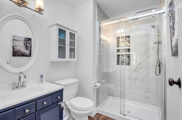 Bathroom, Glass Shower, Interior, Marble Walls, Wood Texture Flooring