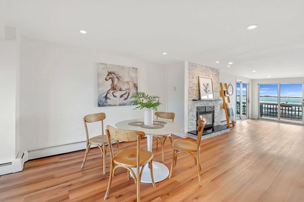 Dining room, Fireplace, Interior, Recessed Lighting, Water, Wood Texture Flooring