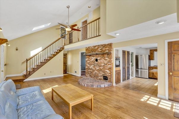 Fireplace, Interior, Kitchen, Recessed Lighting, Stainless Steel Appliances, Stone Walls, Wood Texture Flooring