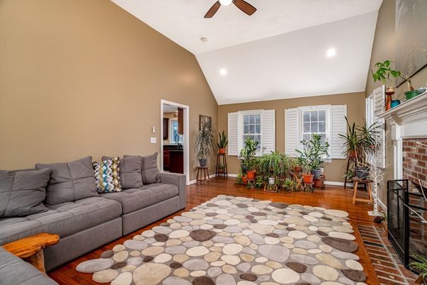 Fireplace, Interior, Living room, Recessed Lighting, Stone Walls, Wood Texture Flooring