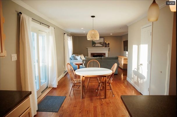 Dining room, Fireplace, Interior, Living room, Pendant Lights, Recessed Lighting, Wood Texture Flooring