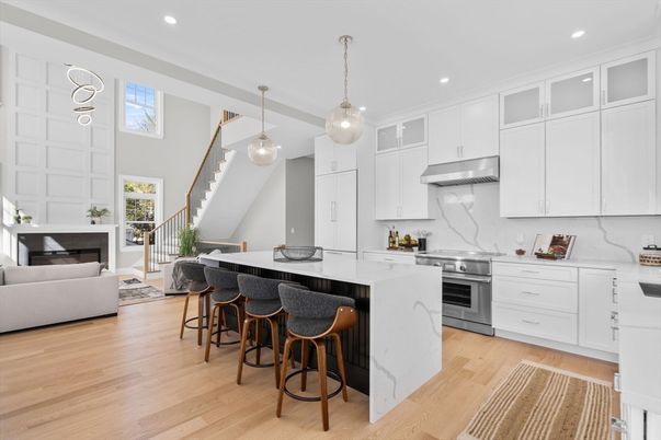 Fireplace, Interior, Kitchen, Living room, Marble Walls, Pendant Lights, Recessed Lighting, Stainless Steel Appliances, Wood Texture Flooring